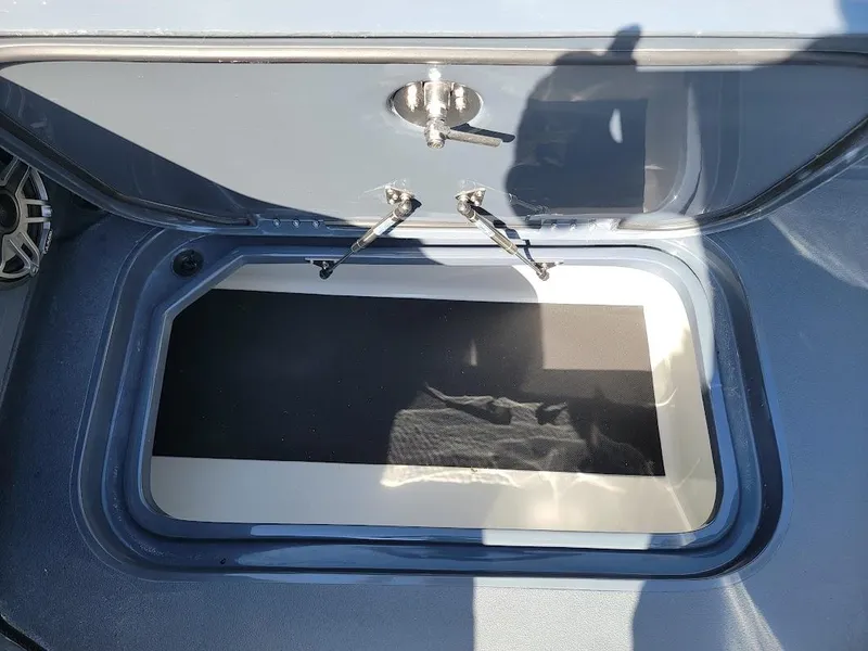 Slide: The Image of Open storage compartment on 2026 Shallow Sport 32 X3 boat. - 41