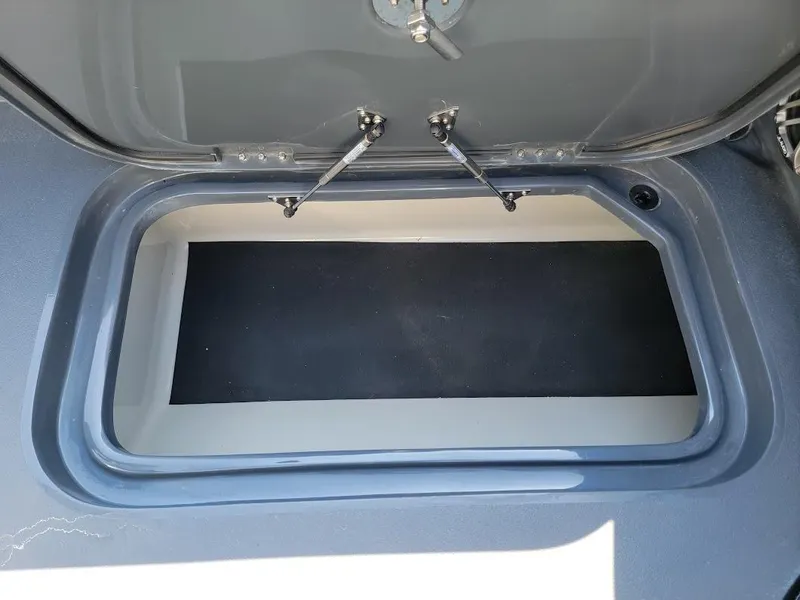 Slide: The Image of Open storage compartment on 2026 Shallow Sport 32 X3 boat. - 42