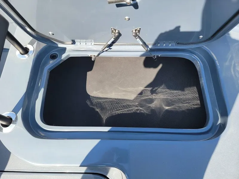 Slide: The Image of Open storage compartment on a 2026 Shallow Sport 32 X3 boat. - 44
