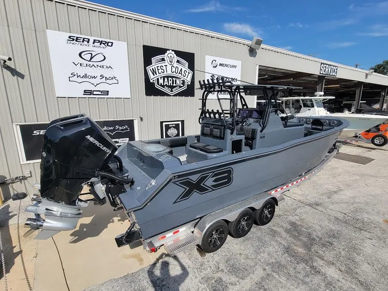 Slide: The Image of Shallow Sport 32 X3 boat, 2026 model, displayed at West Coast Marine dealership. - 5