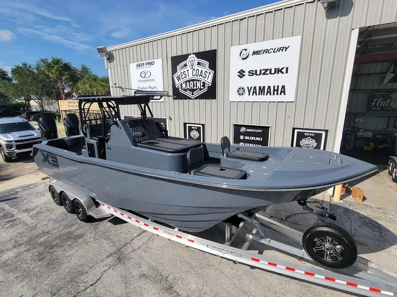 Slide: The Image of 2026 Shallow Sport 32 X3 boat on trailer at West Coast Marine dealership. - 7