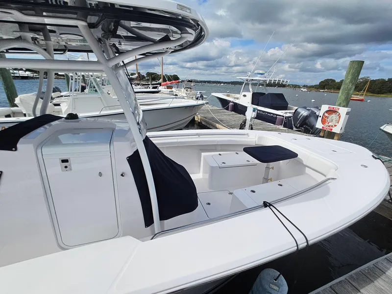 Slide: The Image of 2022 Southport 27 FE boat docked at marina under cloudy sky. - 6