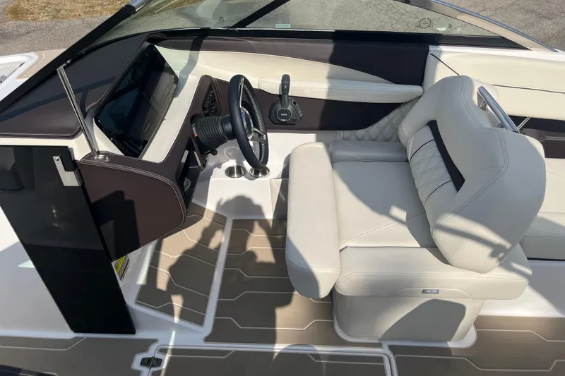 Slide: The Image of 2025 Regal LS4 boat interior with modern steering and luxurious seating. - 11
