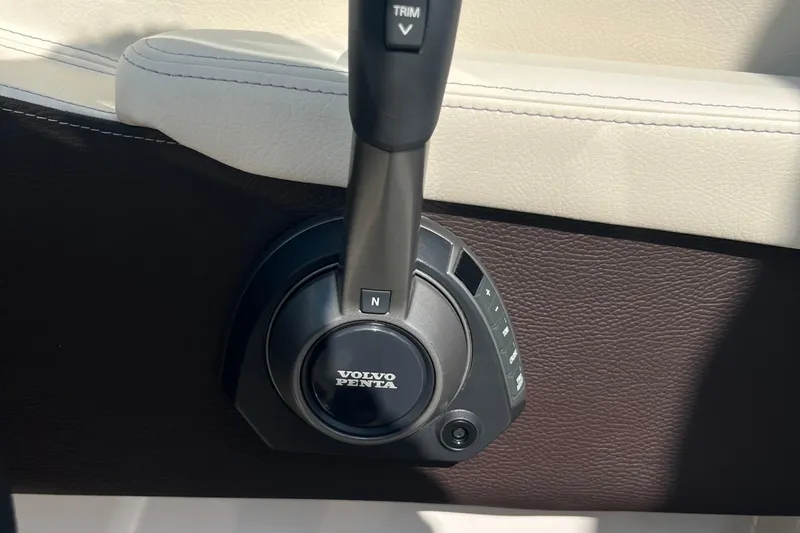 Slide: The Image of Volvo Penta throttle control in 2025 Regal LS4 boat interior. - 13