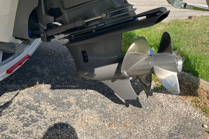 Slide: The Image of 2025 Regal LS4 boat propeller on asphalt, showcasing sleek design and metallic finish. - 17