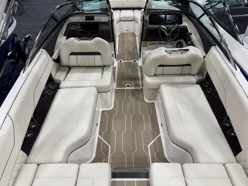 Slide: The Image of 2025 Regal LS4 boat interior with luxurious beige seating and modern design. - 2