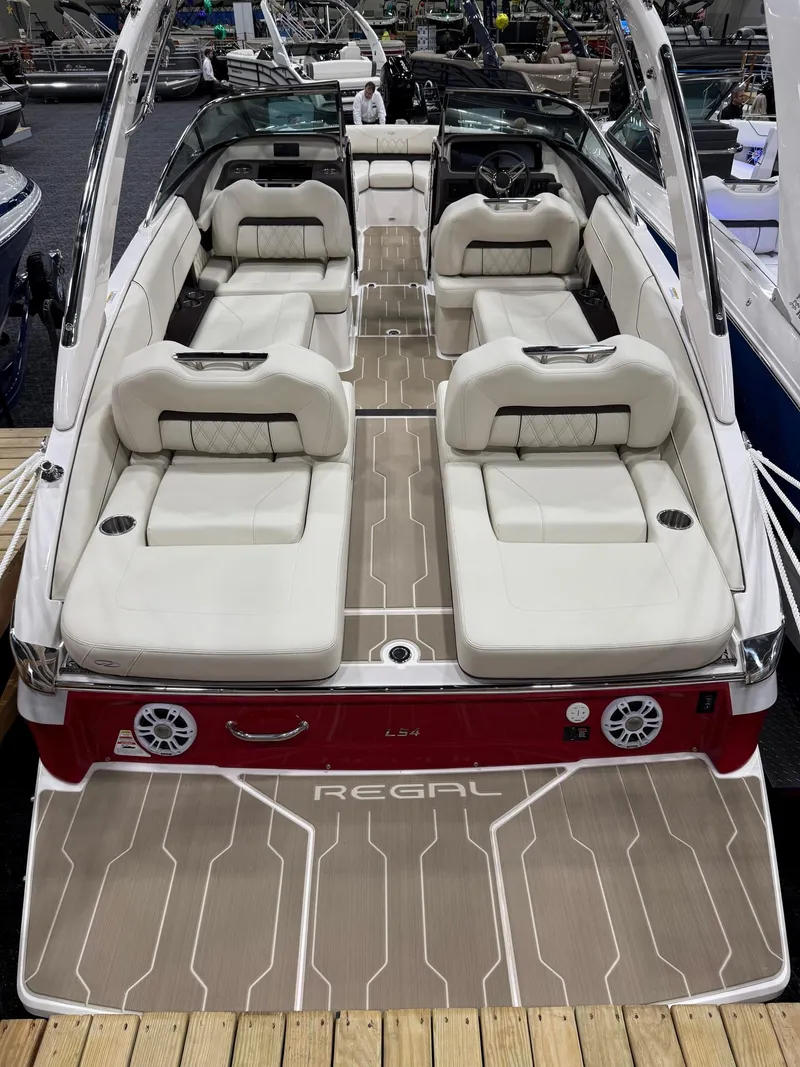 Slide: The Image of 2025 Regal LS4 boat interior with luxurious seating and modern dashboard design. - 4