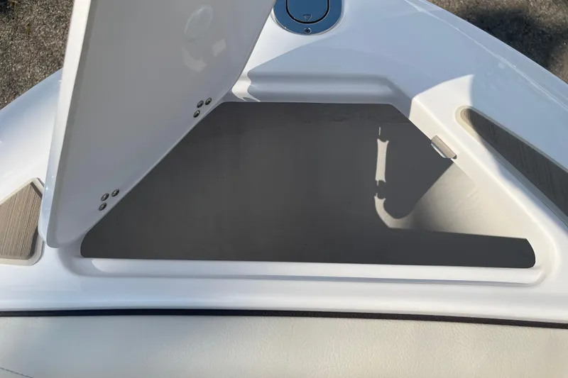 Slide: The Image of Open storage compartment on 2025 Regal LS4 boat, showcasing interior space. - 8