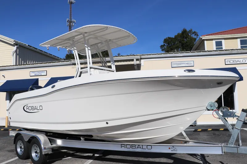 The Image of 2025 Robalo R200 Center Console boat on trailer, displayed outdoors. - 0