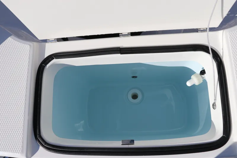 Slide: The Image of Livewell on 2025 Robalo R200 Center Console boat, filled with water. - 12
