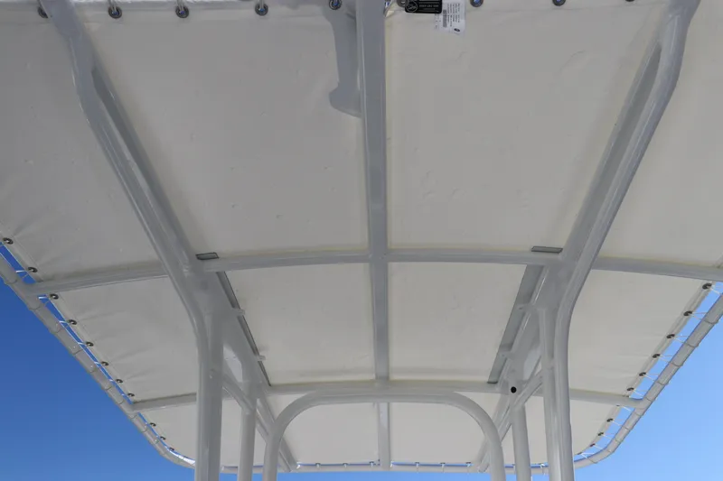 Slide: The Image of 2025 Robalo R200 Center Console boat canopy, viewed from below against a clear blue sky. - 18