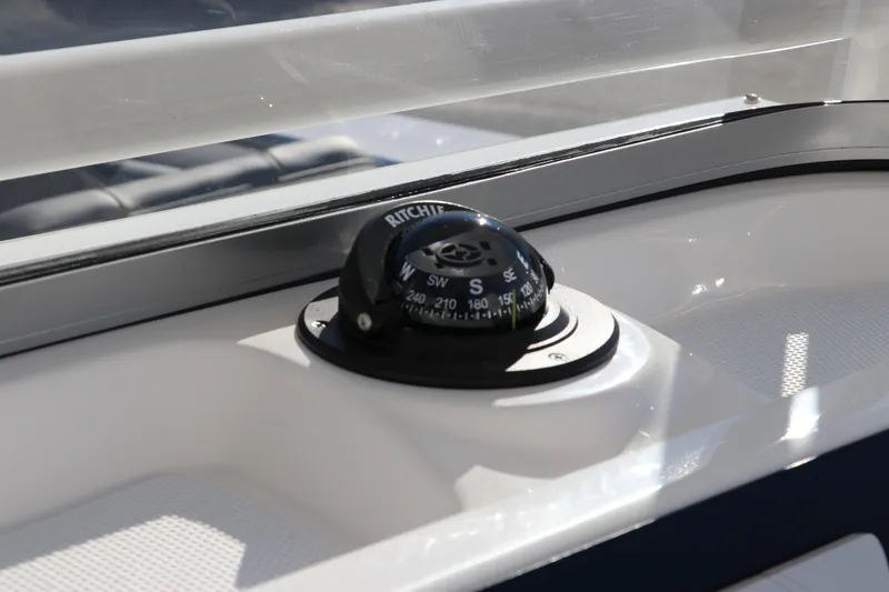 Slide: The Image of Compass on 2025 Robalo R200 Center Console boat dashboard. - 20