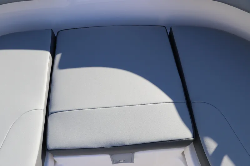 Slide: The Image of 2025 Robalo R200 Center Console boat seating area with gray cushions. - 31