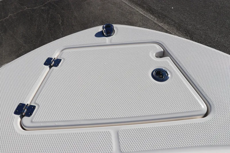 Slide: The Image of 2025 Robalo R200 Center Console boat deck with storage hatch. - 32