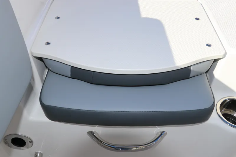 Slide: The Image of 2025 Robalo R200 Center Console boat seat with gray cushion and stainless steel handle. - 7