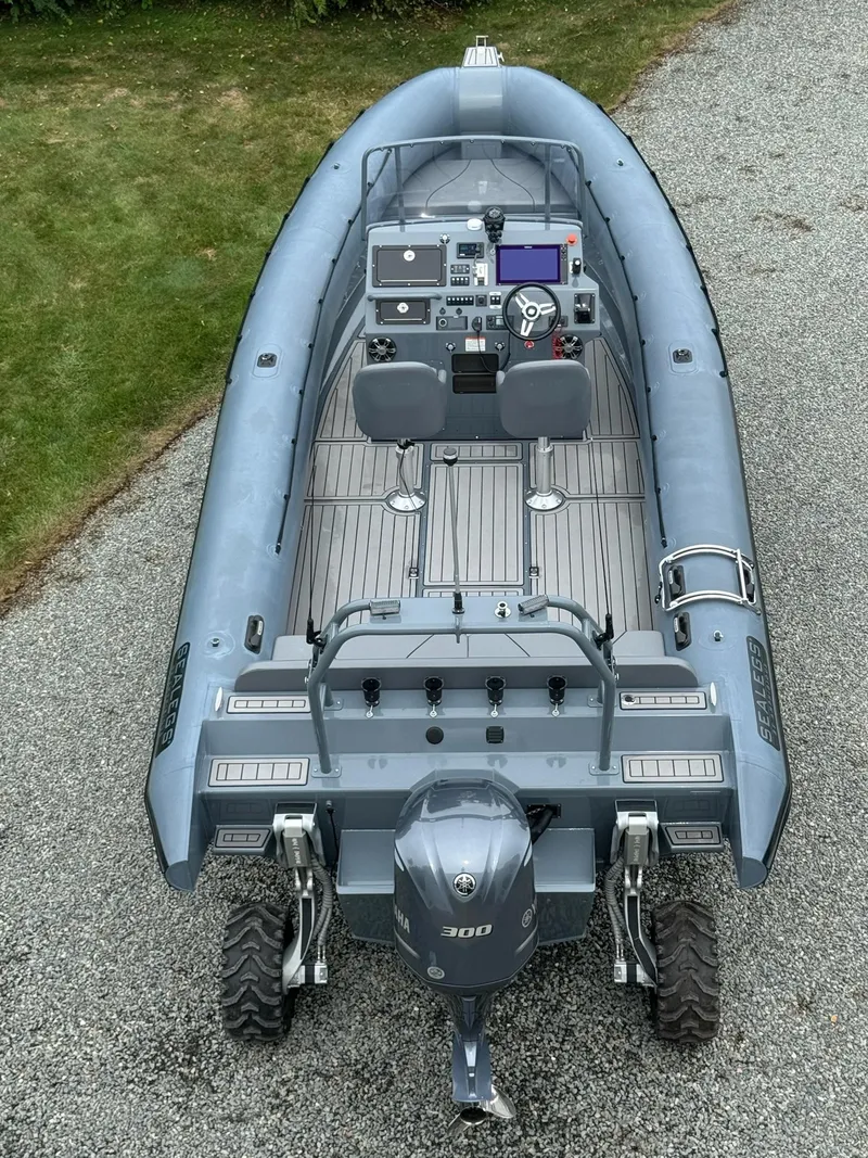 Slide: The Image of Sealegs 9M Hydrosol 2019 amphibious boat on gravel path. - 12