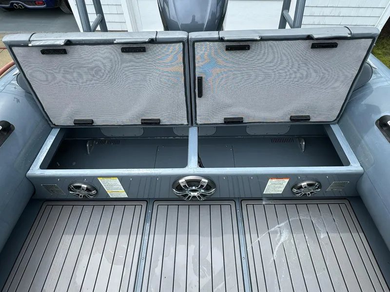 Slide: The Image of 2019 Sealegs 9M Hydrosol with open storage compartments and speakers. - 30