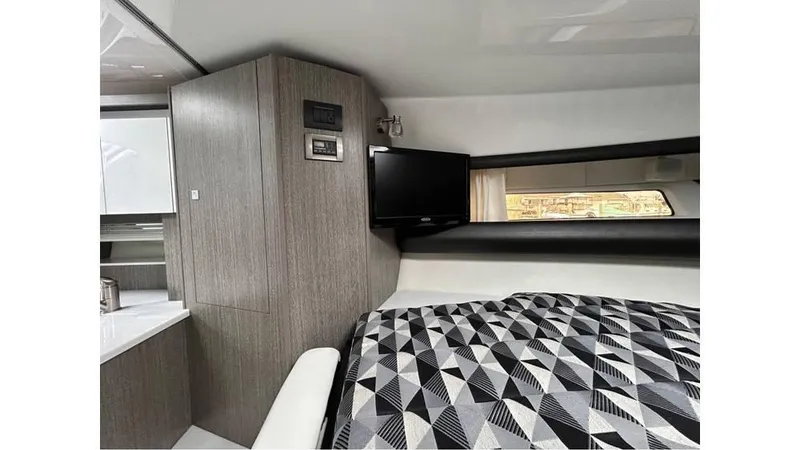 Slide: The Image of Interior of 2021 Monterey 335 Sport Yacht with modern design and geometric bedding. - 13