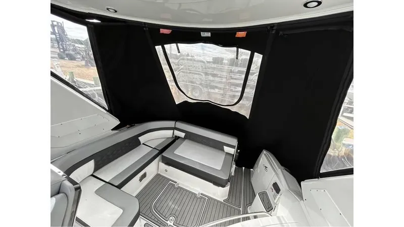 Slide: The Image of 2021 Monterey 335 Sport Yacht interior with sleek seating and modern design. - 5