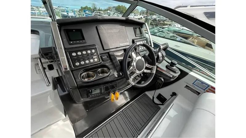 Slide: The Image of Cockpit of 2021 Monterey 335 Sport Yacht with modern controls and steering wheel. - 8