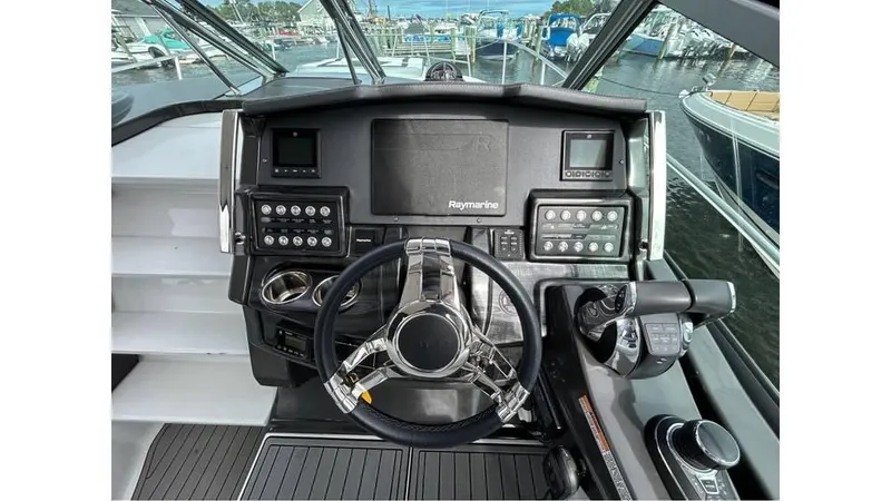 Slide: The Image of Helm of 2021 Monterey 335 Sport Yacht with advanced navigation controls and steering wheel. - 9