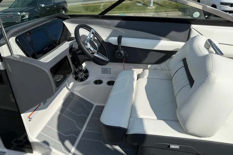 Slide: The Image of 2025 Regal LS6 boat interior with modern dashboard and luxurious seating. - 11