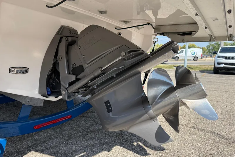 Slide: The Image of 2025 Regal LS6 boat with Volvo Penta outdrive and dual propellers, parked on a trailer. - 13