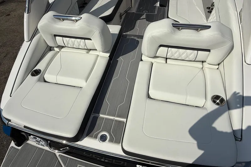 Slide: The Image of 2025 Regal LS6 boat interior with luxurious white seating and modern design. - 17