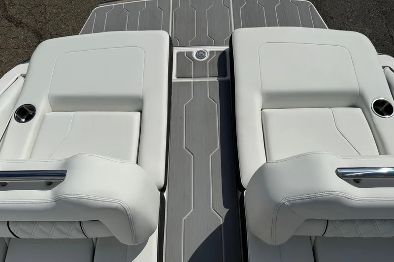 Slide: The Image of 2025 Regal LS6 boat with luxurious white seating and sleek design. - 18
