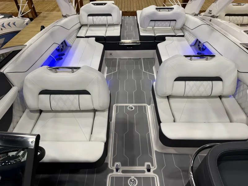 Slide: The Image of Luxurious interior of 2025 Regal LS6 boat with white seating and wooden table. - 4
