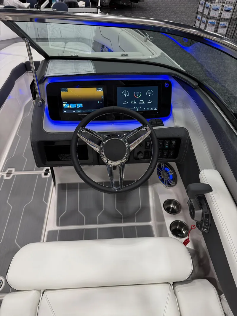 Slide: The Image of Luxurious 2025 Regal LS6 boat interior with white seating and wooden table. - 7