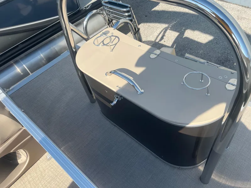 Slide: The Image of 2024 Avalon 2385 LSZ Quad Lounger boat console with sleek design and modern features. - 11