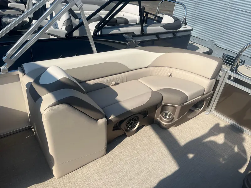 Slide: The Image of 2024 Avalon 2385 LSZ Quad Lounger with beige seating and built-in speakers. - 7