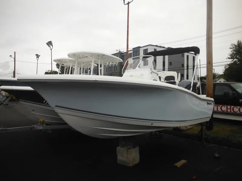 Slide: The Image of 2025 Tidewater 198 CC Adventure boat displayed outdoors on a stand. - 1