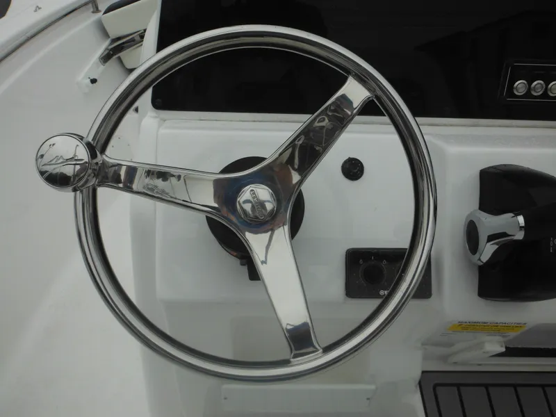 Slide: The Image of Steering wheel of 2025 Tidewater 198 CC Adventure boat, sleek and modern design. - 10