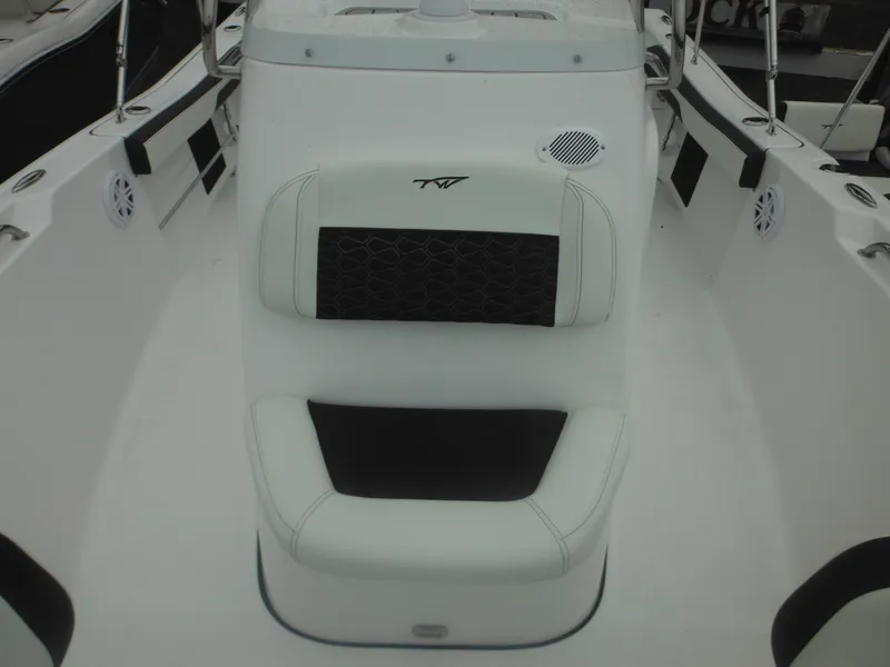 Slide: The Image of 2025 Tidewater 198 CC Adventure boat interior with cushioned seating. - 14