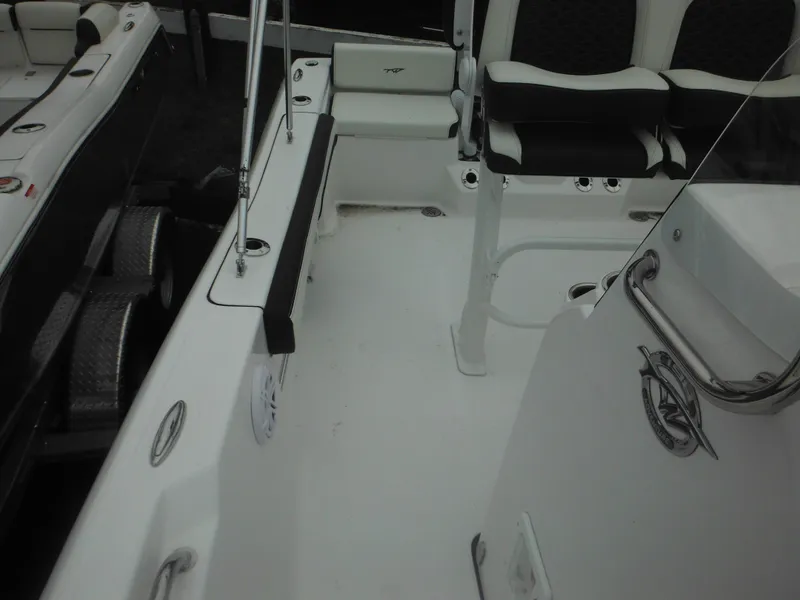 Slide: The Image of 2025 Tidewater 198 CC Adventure boat interior with seating and deck view. - 15
