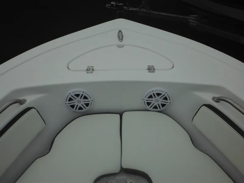 Slide: The Image of 2025 Tidewater 198 CC Adventure boat interior with cushioned seating and speakers. - 17