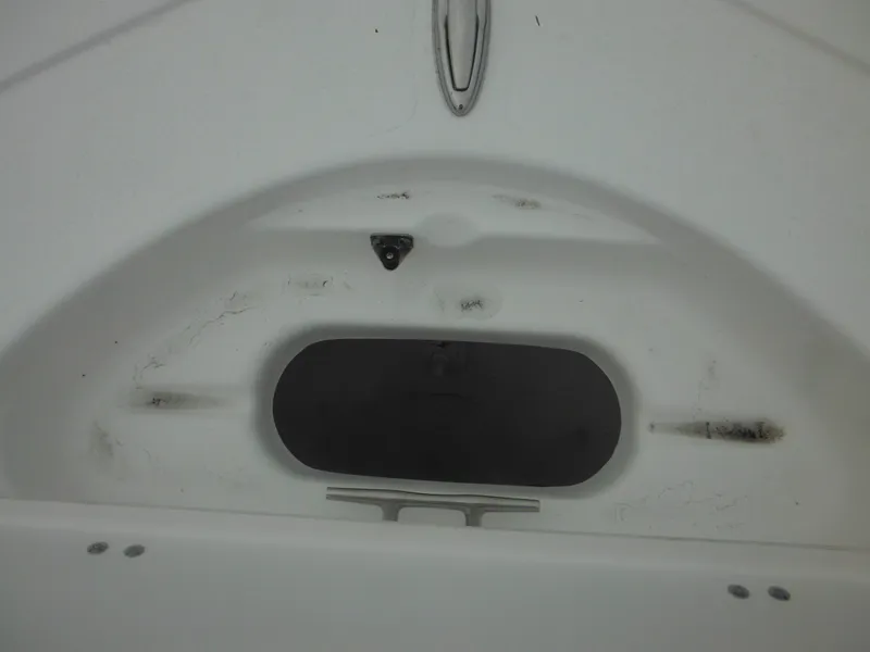 Slide: The Image of 2025 Tidewater 198 CC Adventure boat interior detail, featuring a storage compartment. - 18