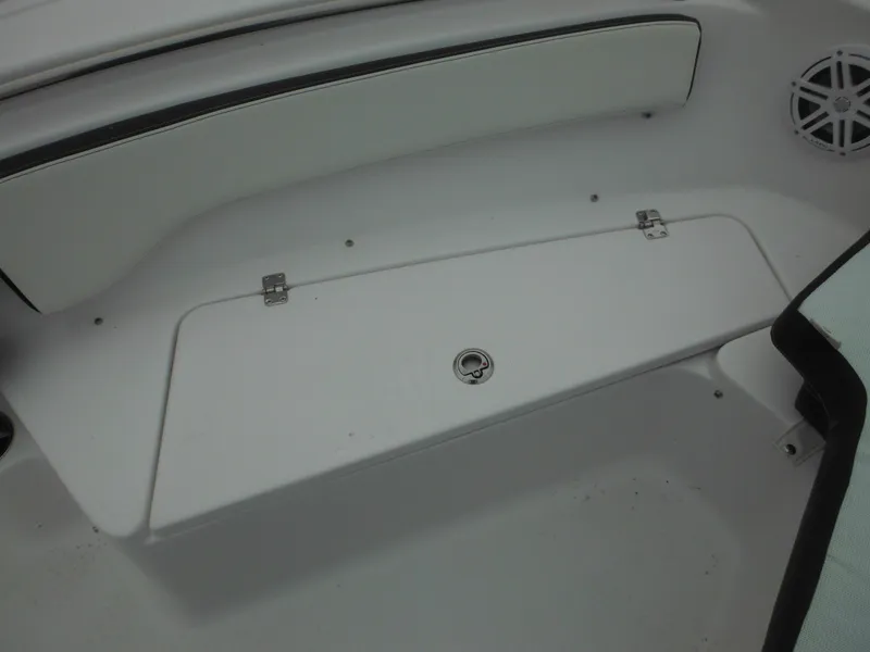 Slide: The Image of 2025 Tidewater 198 CC Adventure boat interior, featuring storage compartment and seating area. - 26