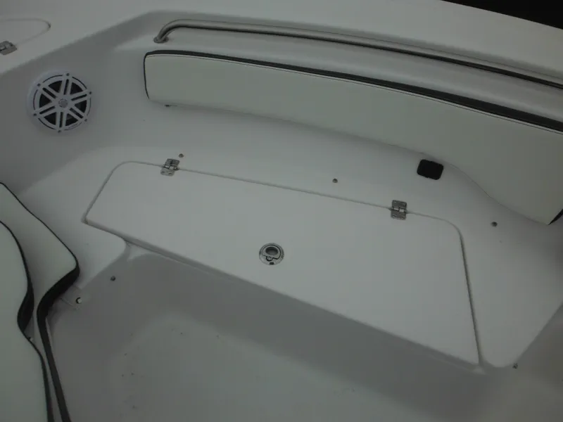 Slide: The Image of 2025 Tidewater 198 CC Adventure boat interior with seating and storage compartment. - 28