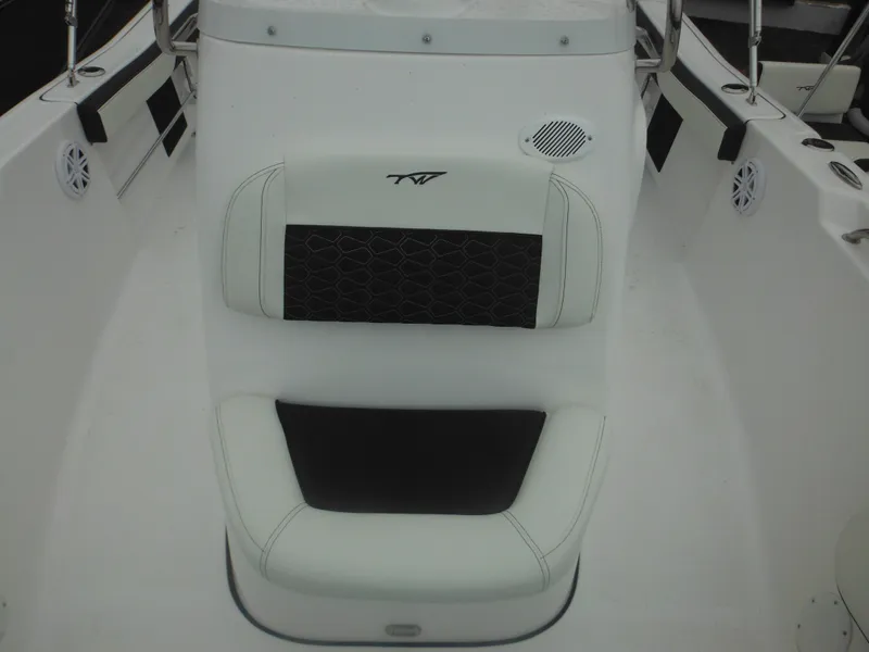 Slide: The Image of 2025 Tidewater 198 CC Adventure boat seat with black and white upholstery. - 29