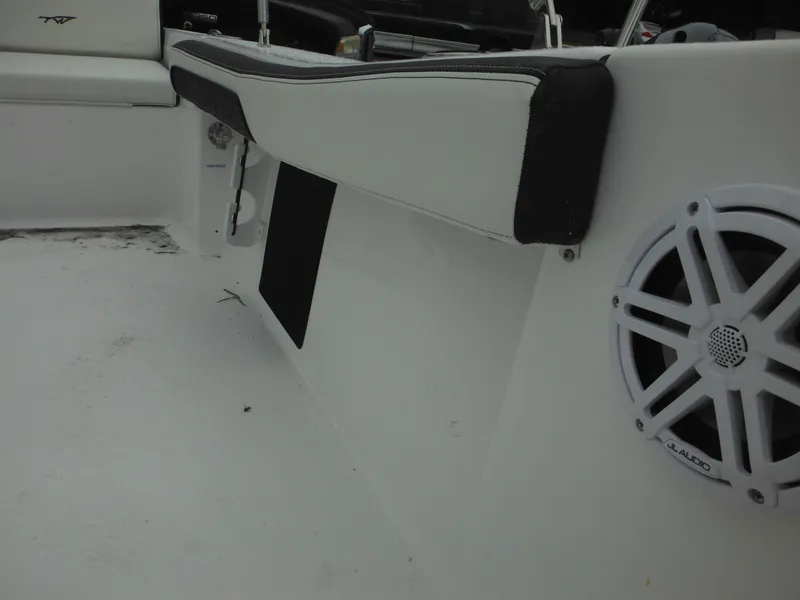 Slide: The Image of 2025 Tidewater 198 CC Adventure boat interior with speaker and seating detail. - 30