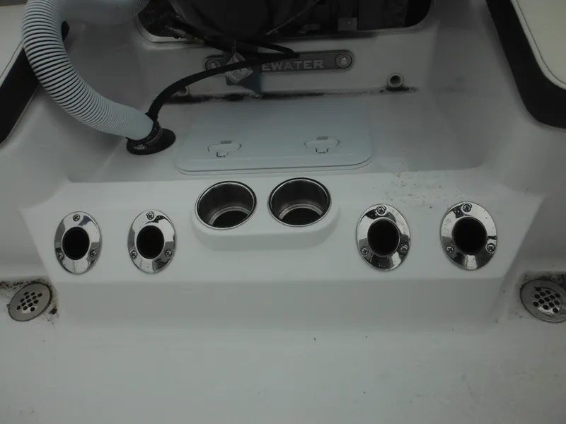 Slide: The Image of 2025 Tidewater 198 CC Adventure boat deck with cup holders and fittings. - 40