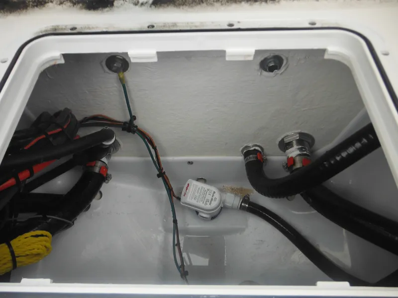 Slide: The Image of 2025 Tidewater 198 CC Adventure boat wiring and plumbing compartment. - 41