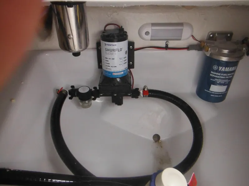 Slide: The Image of 2025 Tidewater 198 CC Adventure boat plumbing system with Shurflo pump and Yamaha filter. - 42