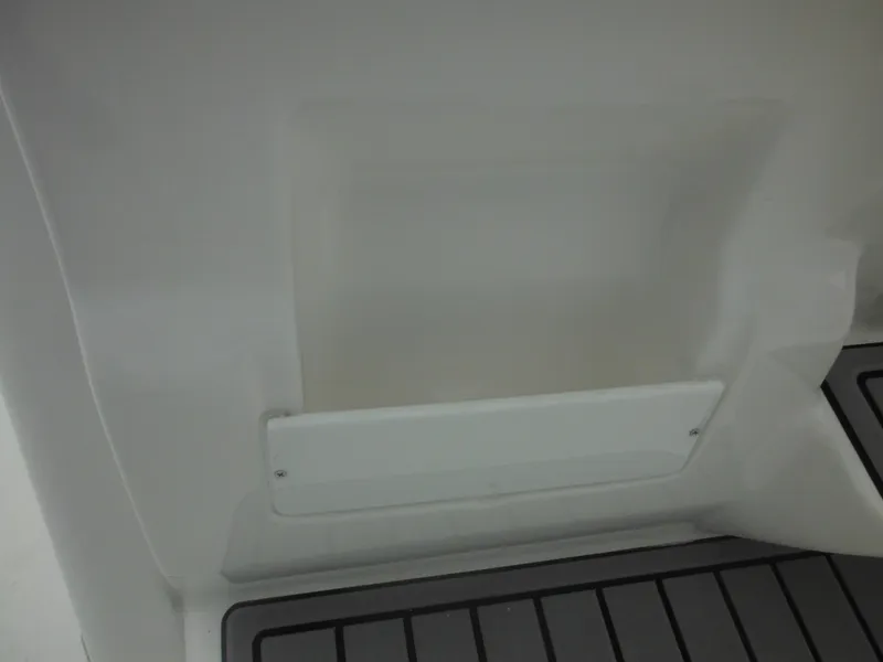 Slide: The Image of Interior detail of 2025 Tidewater 198 CC Adventure boat, featuring storage compartment. - 45