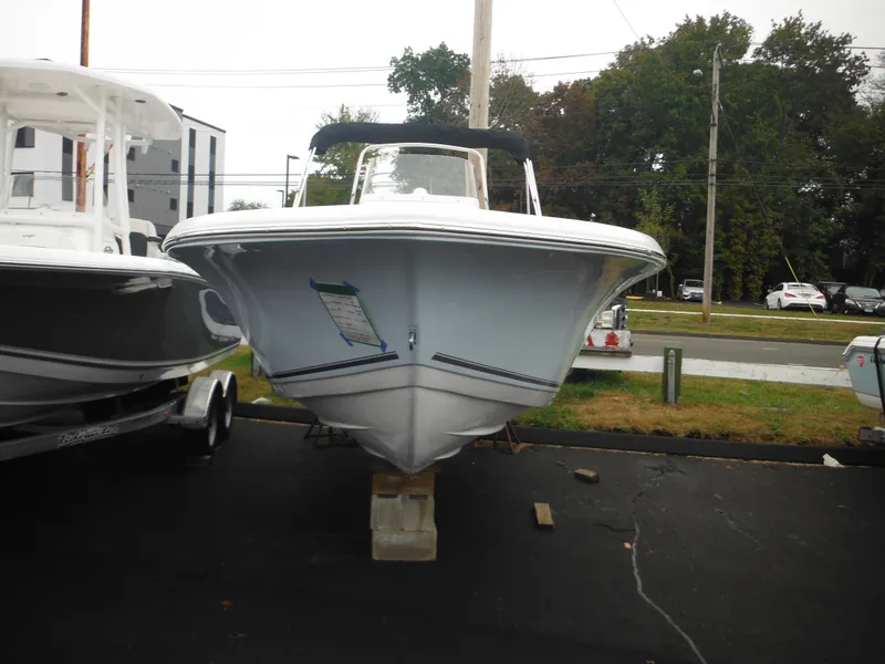 Slide: The Image of 2025 Tidewater 198 CC Adventure boat displayed outdoors on a stand. - 47