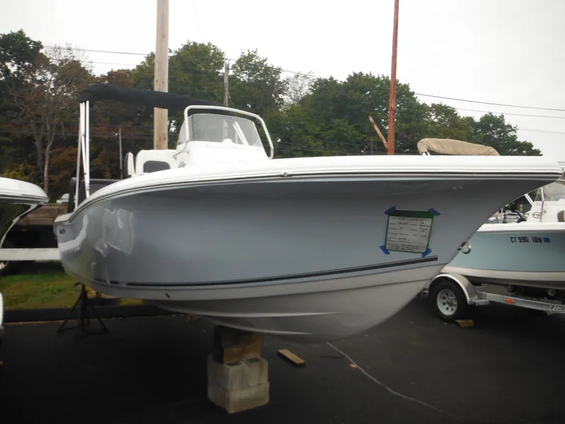 Slide: The Image of 2025 Tidewater 198 CC Adventure boat displayed outdoors on a stand. - 48