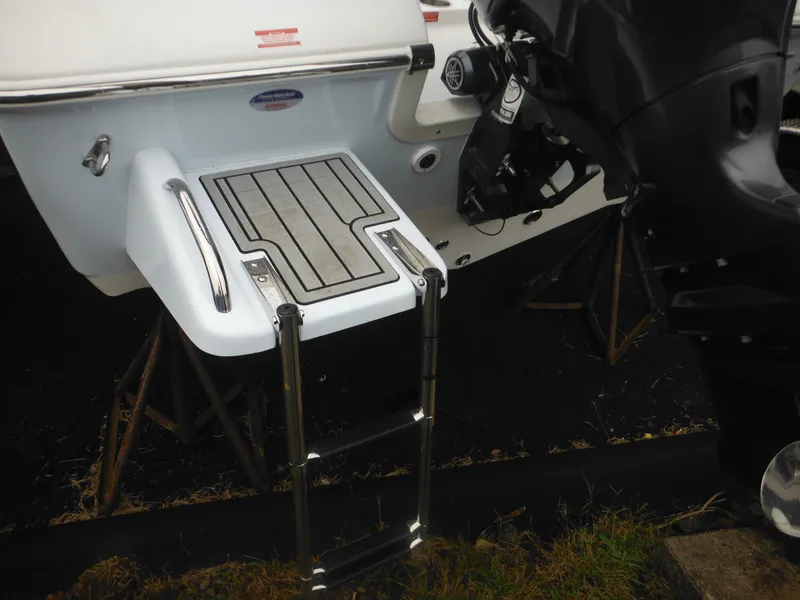 Slide: The Image of 2025 Tidewater 198 CC Adventure boat with swim platform and ladder. - 5